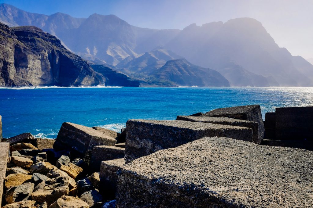 Entrance to the mouth of the port of Agaete with the beautiful cliffs of the island of Gran Canaria