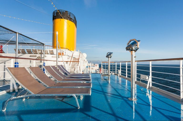 upper deck of cruise liner with empty chairs